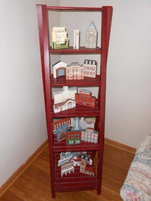 step ladder style shelf unit with  collectible Cats Meow vintage buildings