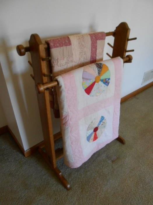 Quilt rack with vintage quilts