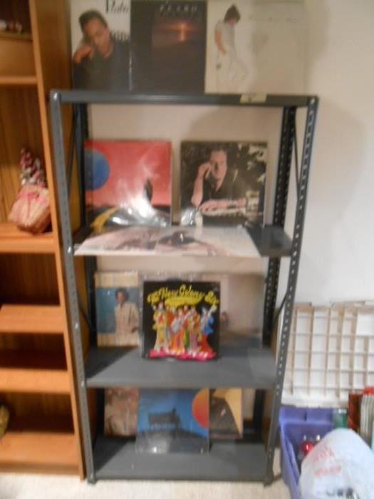 Some LP records and more metal shelves.