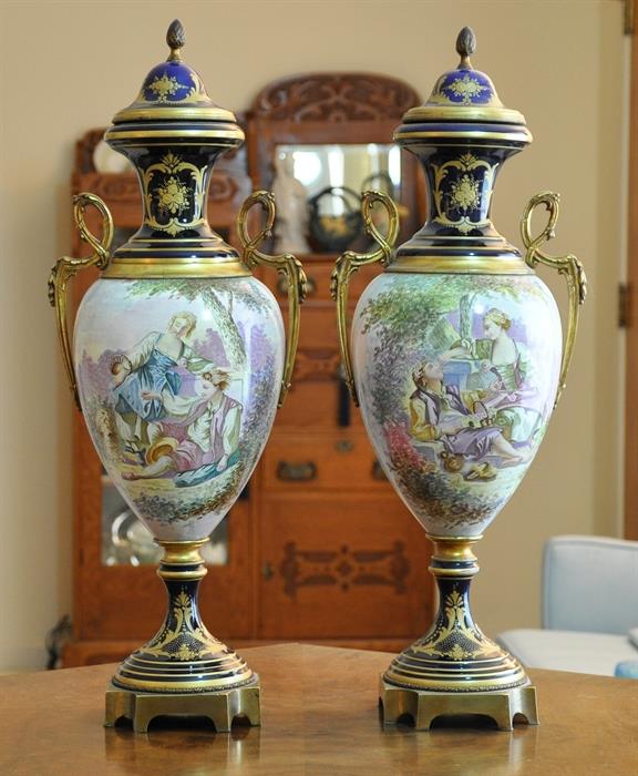 Early 20th century Sevres style urns, handpainted by know artist, 24 inches tall