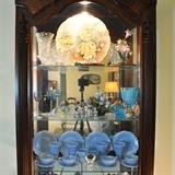 View of the interior of the smaller display cabinet. Of special note is the child's set of Jeannette Glass Cherry Blossom in Delphite.  This is not a reproduction, owner was a serious collector.