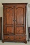 Bassett three way armoire was purchased for over $1700.  It has a bar to hang clothes on.  It has shelves.  Or, it can hold a flat screen t.v.