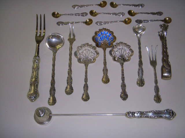 Some of the unusual serving pieces included with the set of Strasbourg sterling flatware.  Salt spoons have gold washed bowls.  Central bon bon spoon has unusual blue enamel accent