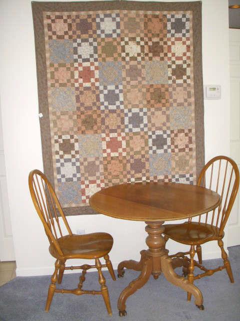 Lovely quilt, 19th Century table, and newer windsor style chairs