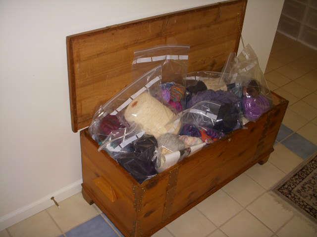 Cedar chest full of bagged yarn