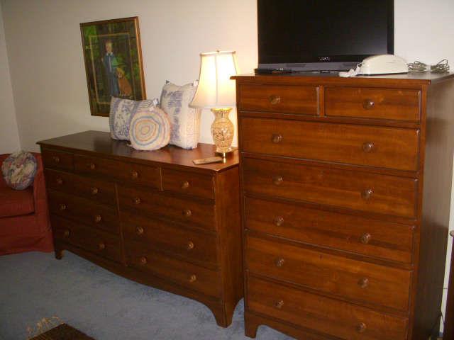 Cherry dressers by Durham Furniture Company.  Lamp is cut glass, but no signature found.  On top of tall chest is Vizio flat screen TV