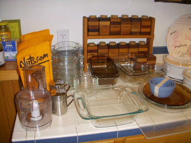 Kitchen items.  Note unusual spice rack made of various woods