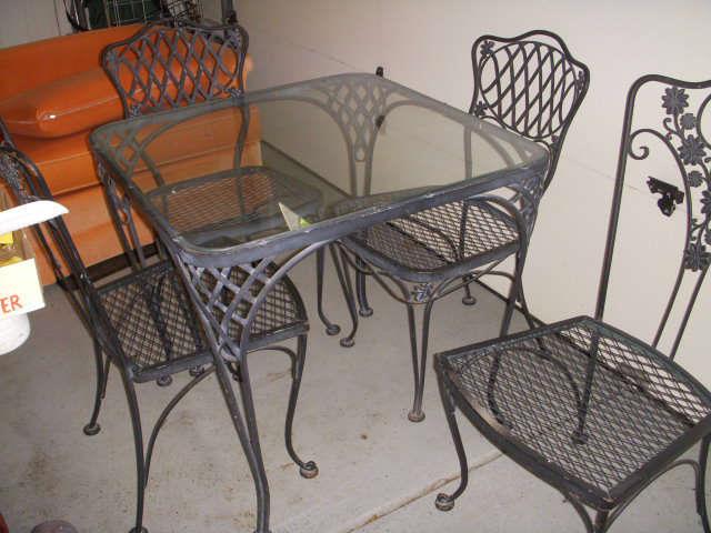 Woodard table with two pairs of chairs
