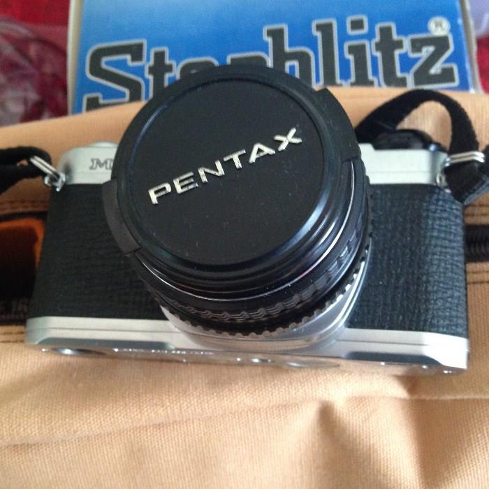 vintage pentax camera with accessories