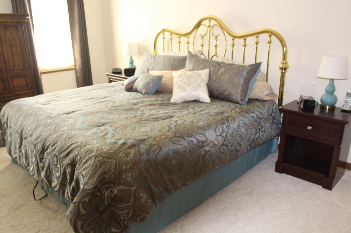 Nice brass bed and bedding - I believe this is a king size bed.