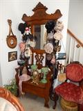Massive hall tree with seat covered with vintage purses, mantel lustres