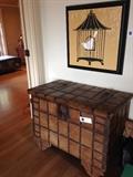 Antique rolling trunk or perhaps a cart? Great original piece of art hanging above for sale too