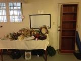 Holiday items and teak bookcase.