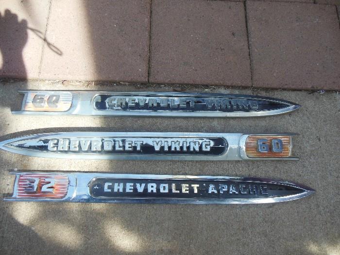 two Chevy Viking emblems and one apache emblem 