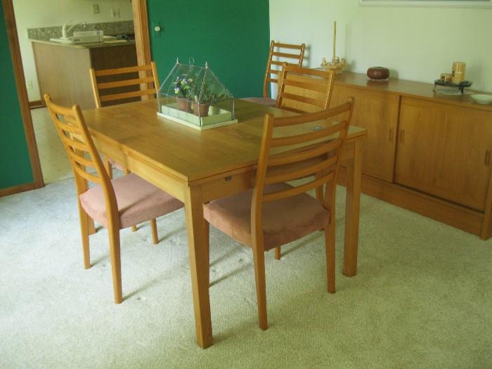 Teak self storing table with four chairs