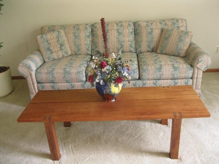 wood coffee table    floral sofa