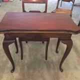 Convertible game table.  Folded to fit against the wall.