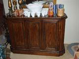 one of several pieces of Drexel furniture. This piece has a sliding top for serving.