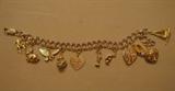 14k charms on silver bracelet