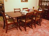 mahogany dining table with leaves and 6 chairs