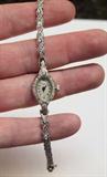 up close of ladies 14K white gold and diamond wristwatch