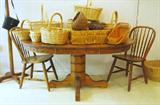 oval oak pedestal dining table, collectible baskets including Longaberger, oak chairs
