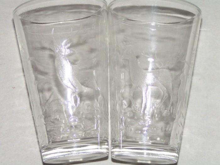 Antique juice cups with etched animal scene