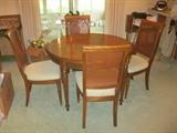 Dining room table with four chairs and two leaves