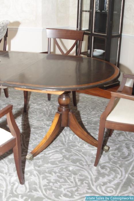 Federal style two pedestal table with six chairs.