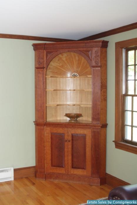 Eldred Wheeler corner cupboard with modesty piece, floral carvings
