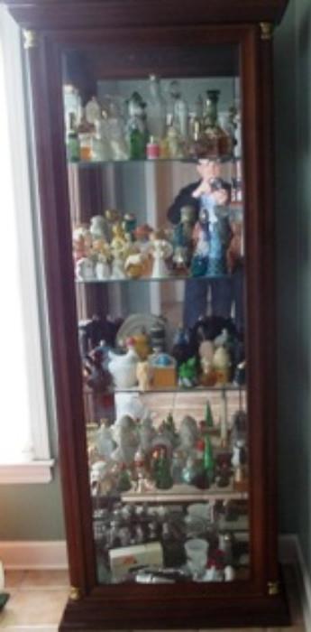 One of two Lighted curio cabinets