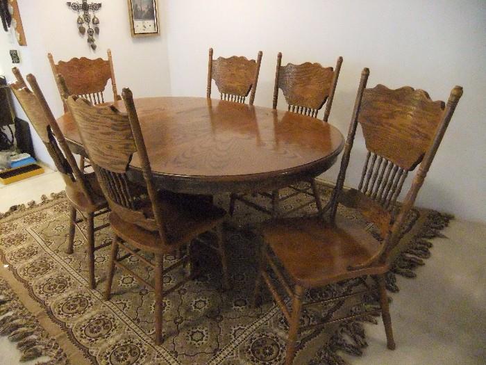 Oak Table with 6 Pressed back Chairs