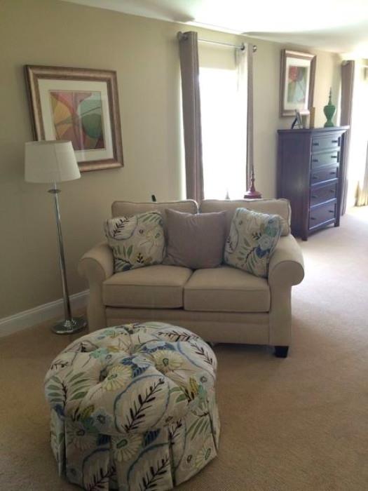 Broyhill off white loveseat and floral ottoman