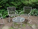 Two side chairs and table with woven strapping on metal frames