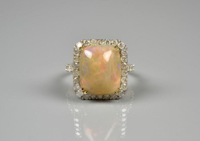 Lot 59: AN OPAL AND DIAMOND RING