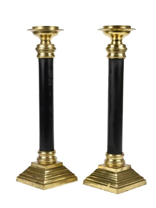 Lot 69: A PAIR OF EMPIRE STYLE EBONIZED AND GILT METAL PRICKET STICKS