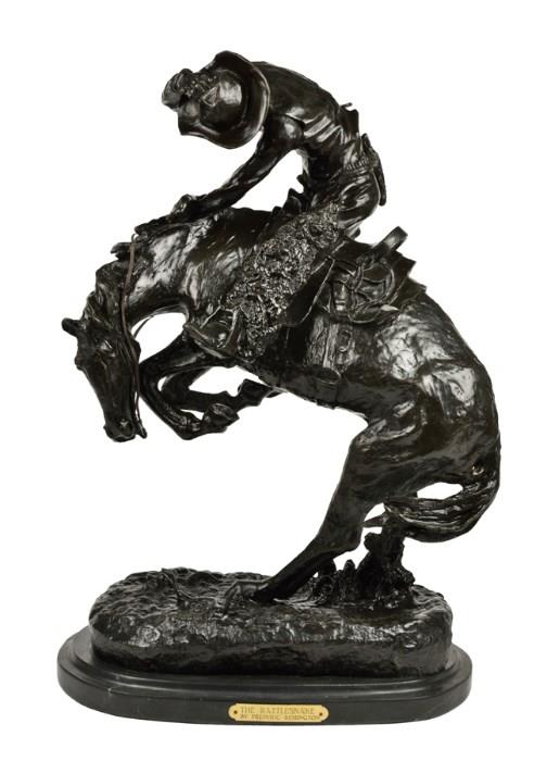 Lot 87: AFTER FREDERIC REMINGTON, (American, 1861-1909), The Rattlesnake, Patinated bronze, H 23 x W 16½ x D 11 inches.