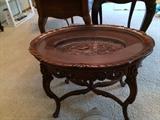 Carved coffee table with glass top