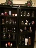 2 black book shelves, glassware