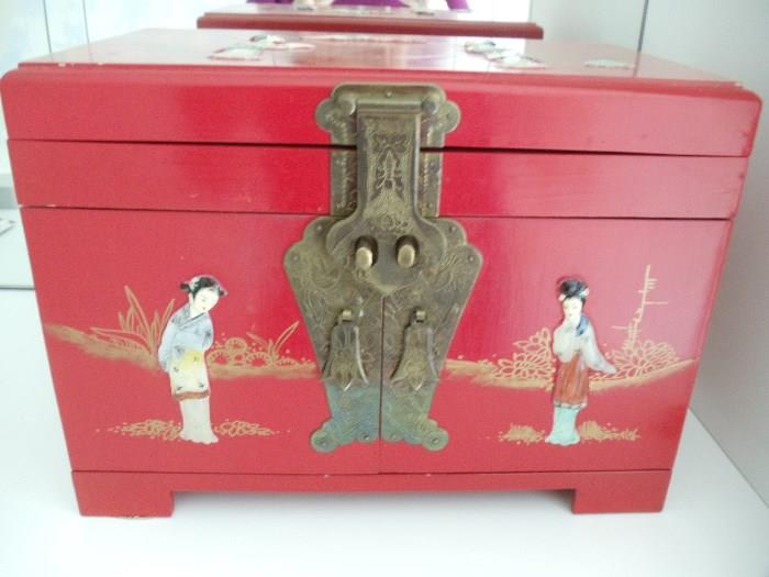 Red Lacquer Jewelry Box with Bronze Closures and Bas Relief Figures