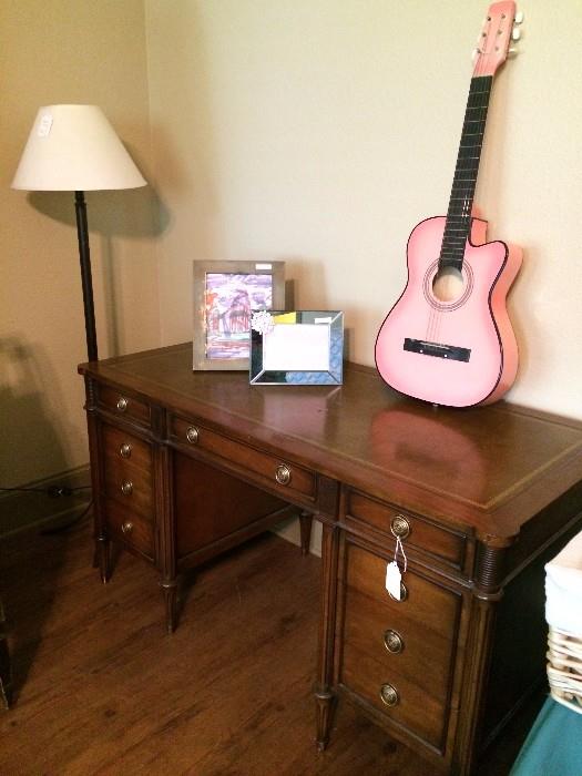       Floor lamp; desk; pink guitar (no case)