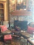 Leather chairs; needlepoint foot stool; large framed art