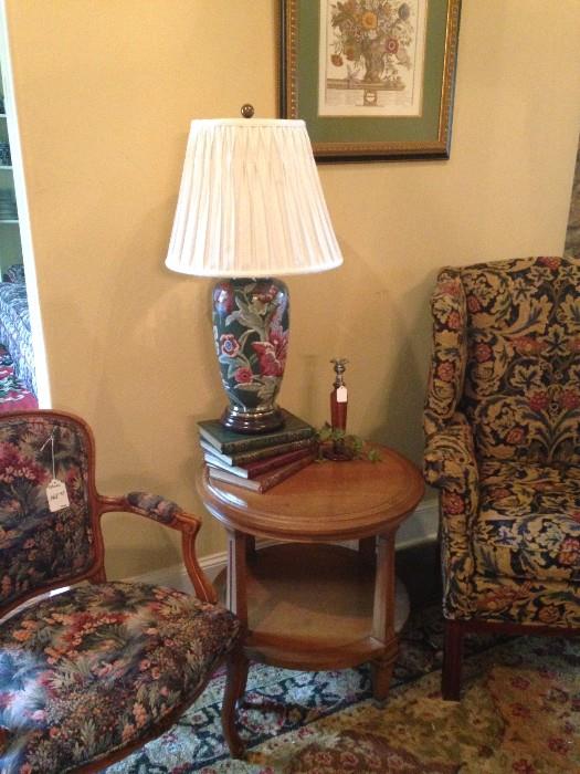  Arm chair; two-tiered table; wing back chair; one of the many lamps