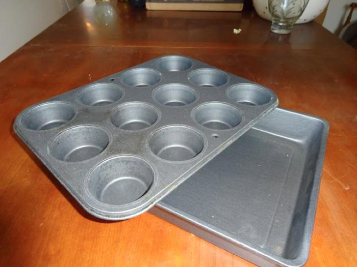 A teflon coated muffin pan and cake pan.