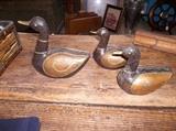 Wooden carved ducks with copper wings