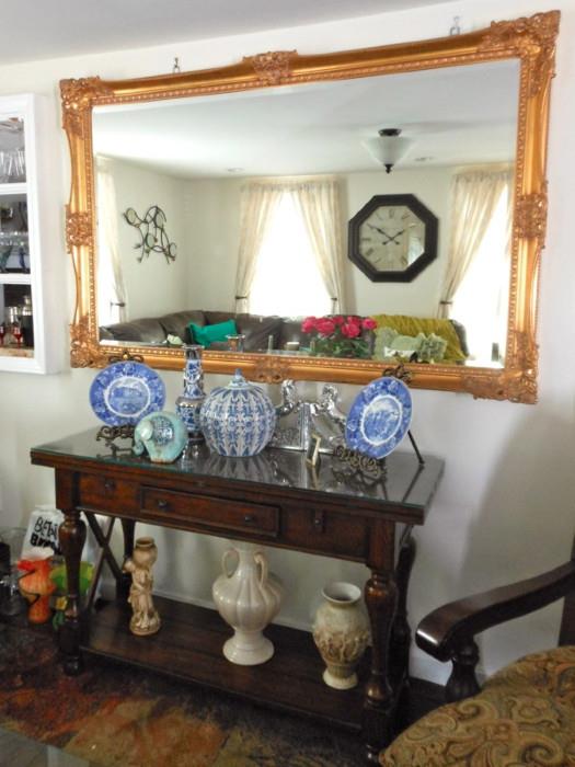 Ashley Furniture console table and gilt wall mirror