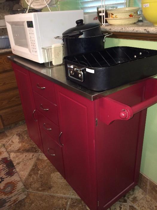       Red cabinet on wheels - great for an island