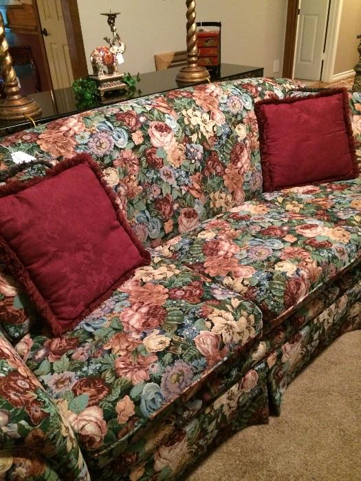          Floral sofa has matching love seat.