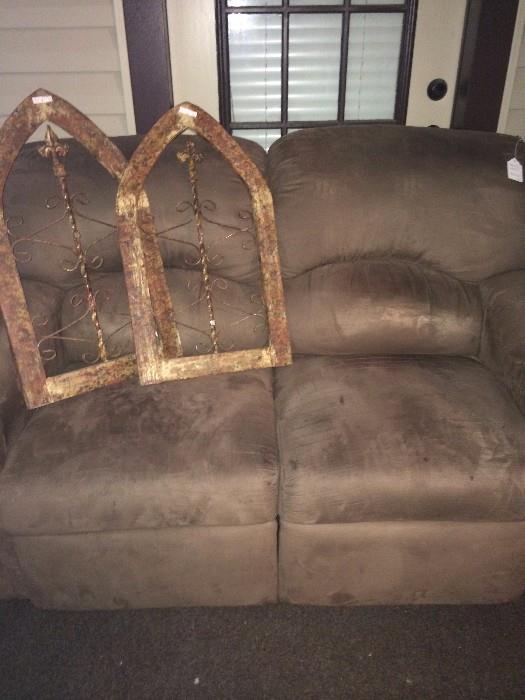       Brown love seat; 2 pieces of wall decor 