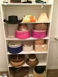         A variety of hats and hat boxes.